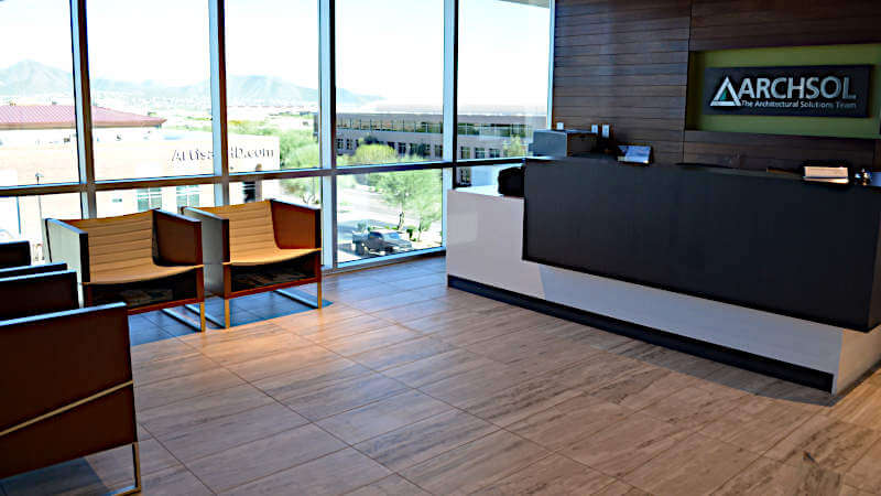 This is a picture of a porcelain tile installation in an office building that looks like natural stone