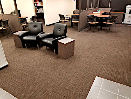 This is a picture of a commercial flooring installation of carpet squares tiles installed in a local bank lobby